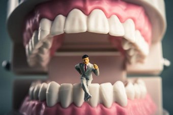 Fictional man giving interpretation of teeth dreams